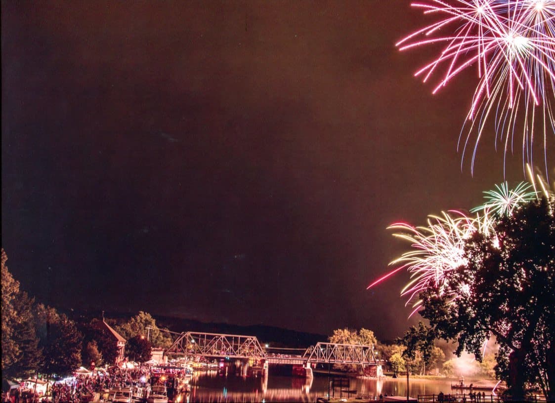 Fireworks over a Waterford bridge and waterfront