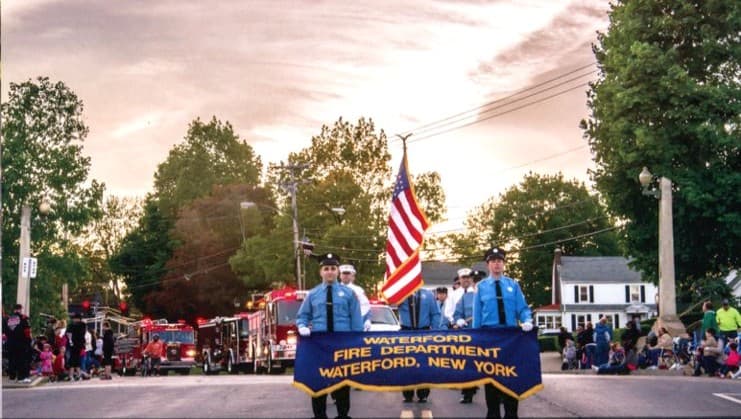 Waterford fire department parade moving through the village